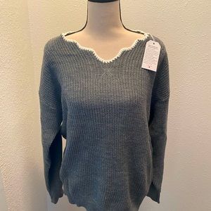 Super soft Heather gray sweater. Brand new. Unique neck line.